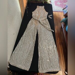 SEXY SPARKLY SLEEK!!! This jumpsuit gives you all of that and more.